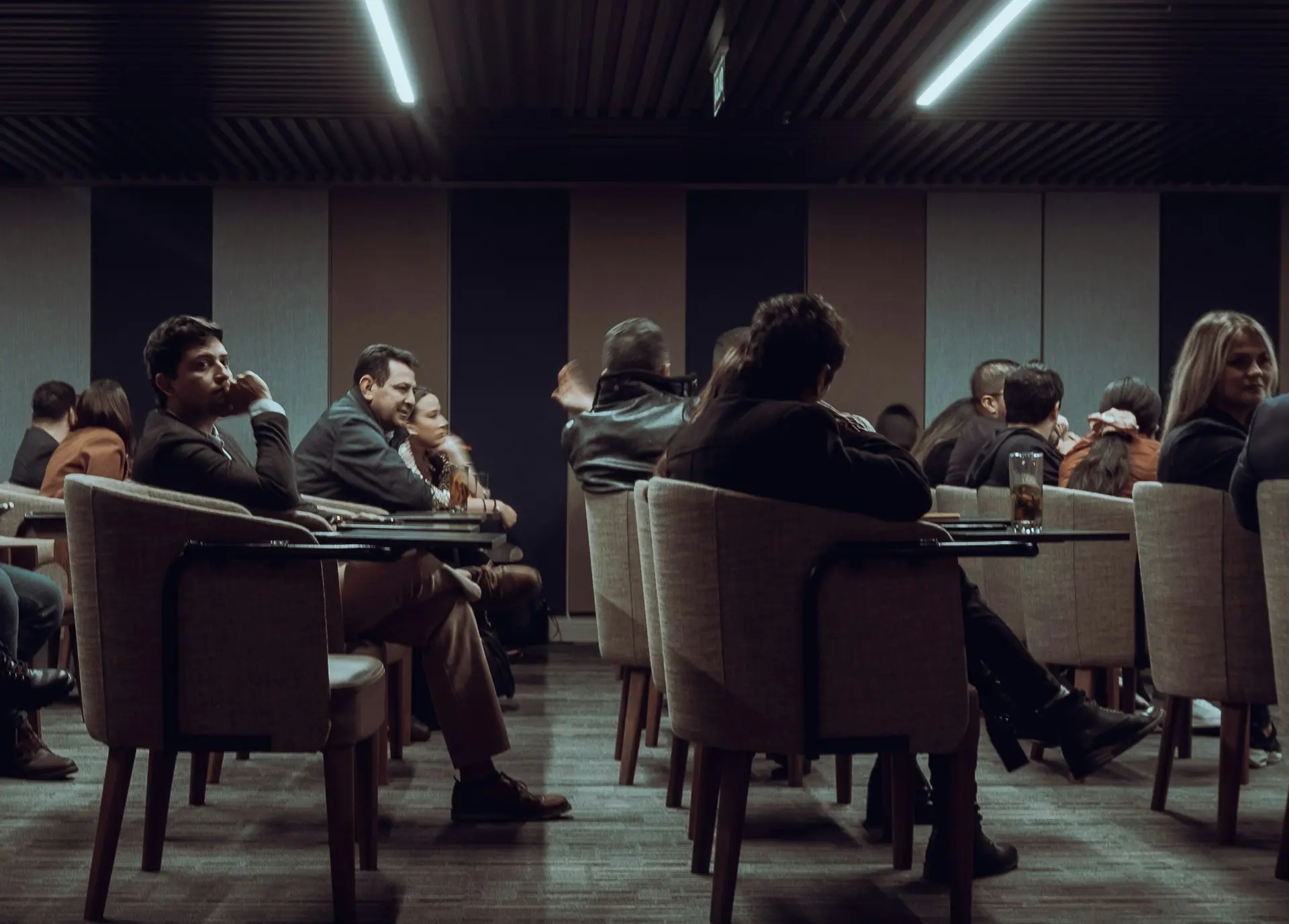 a group of people sitting at tables